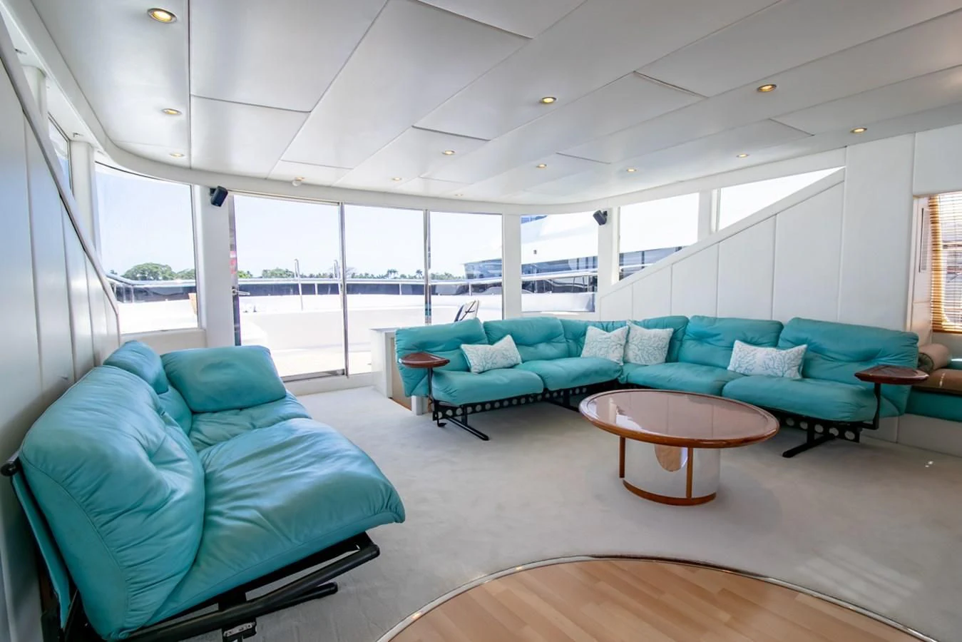a living room with a large glass window aboard SHALIMAR Yacht for Sale