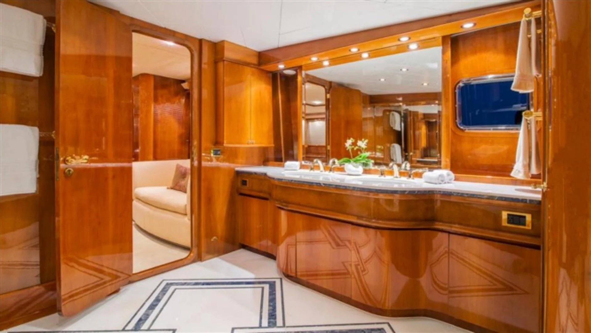 a bathroom with a large mirror aboard SHALIMAR Yacht for Sale