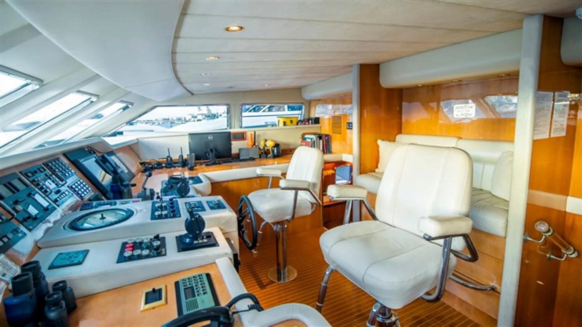 a room with a desk and chairs aboard SHALIMAR Yacht for Sale
