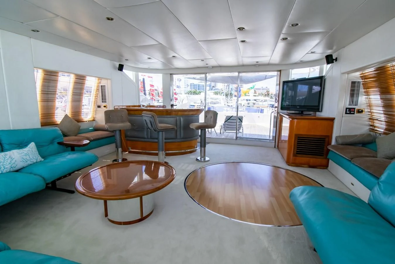 a living room with a table and chairs aboard SHALIMAR Yacht for Sale