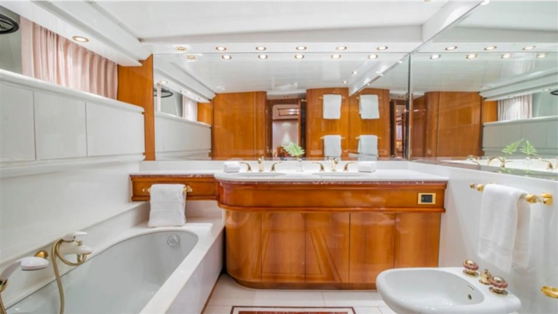 a bathroom with a sink and tub aboard SHALIMAR Yacht for Sale