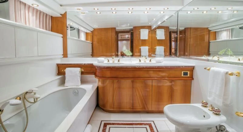 a bathroom with a sink and a bathtub aboard SHALIMAR Yacht for Sale