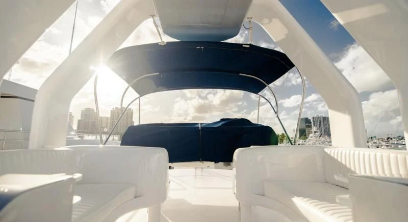a large white tent with chairs and a blue tent aboard SHALIMAR Yacht for Sale