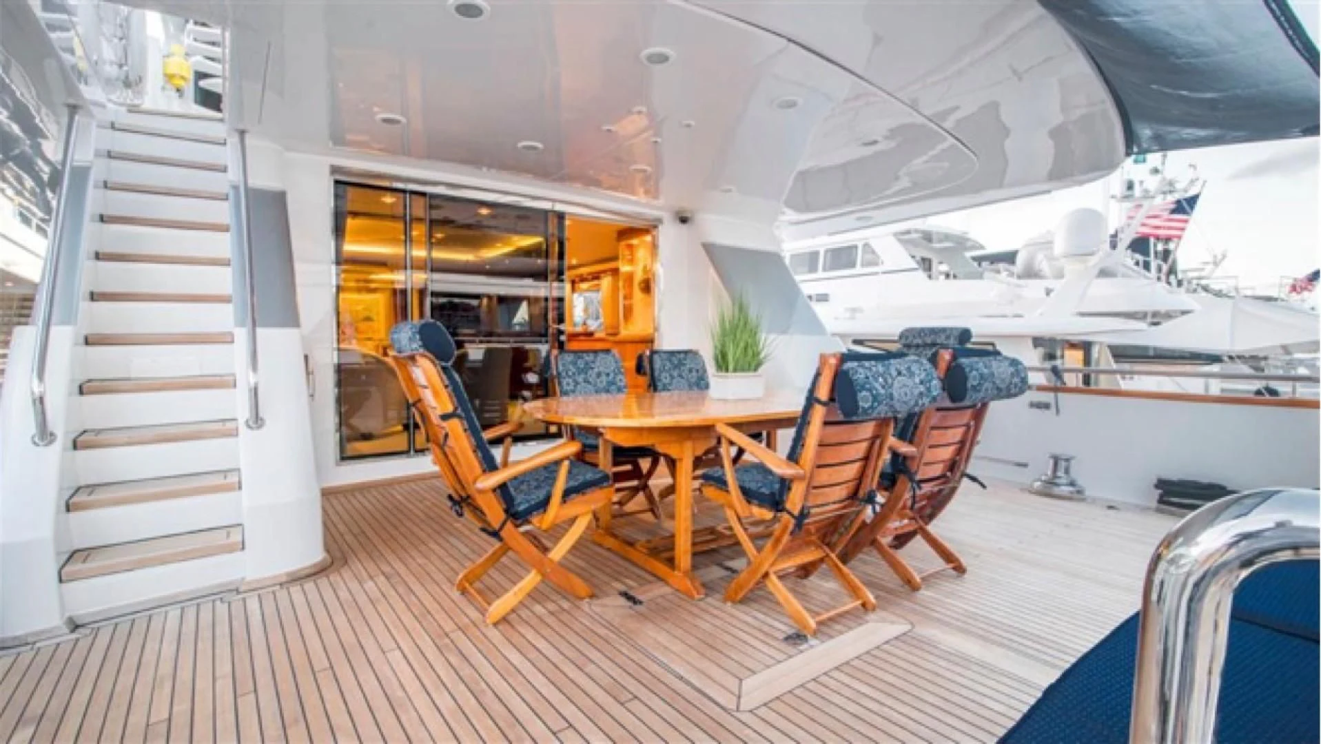 a boat with chairs and tables aboard SHALIMAR Yacht for Sale