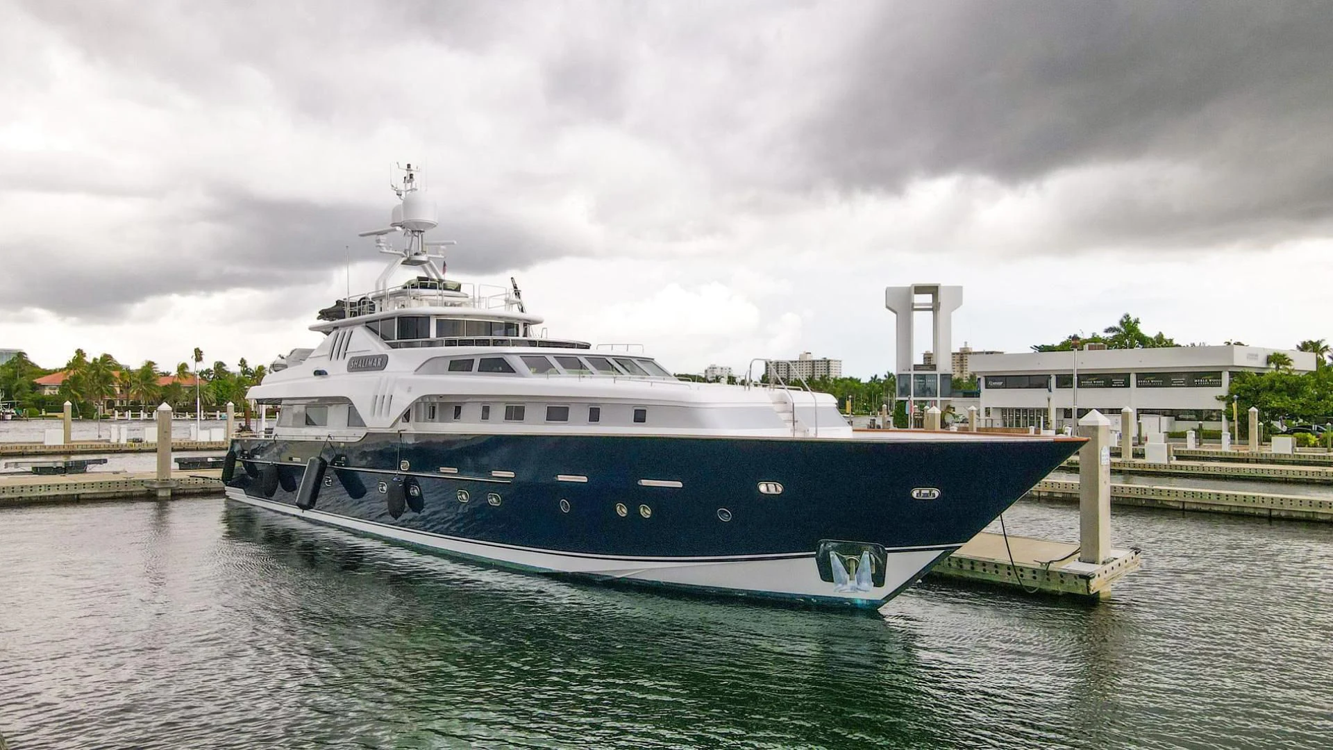 a large boat in a harbor aboard SHALIMAR Yacht for Sale