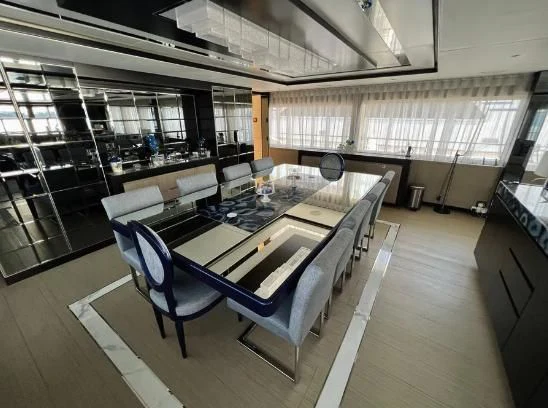 a room with a table and chairs aboard HAPPY DAYS 1 Yacht for Sale