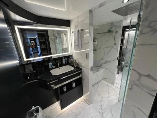 a bathroom with a glass shower aboard HAPPY DAYS 1 Yacht for Sale
