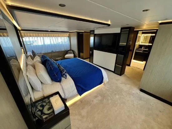 a bedroom with a bed and a large window aboard HAPPY DAYS 1 Yacht for Sale