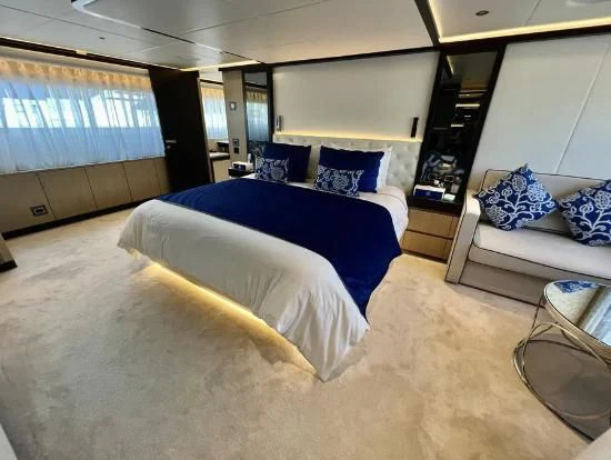 a room with a bed and a desk aboard HAPPY DAYS 1 Yacht for Sale