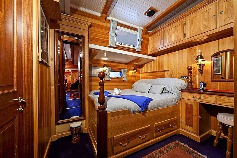 a bed in a cabin aboard TIGERLILY OF CORNWALL Yacht for Sale