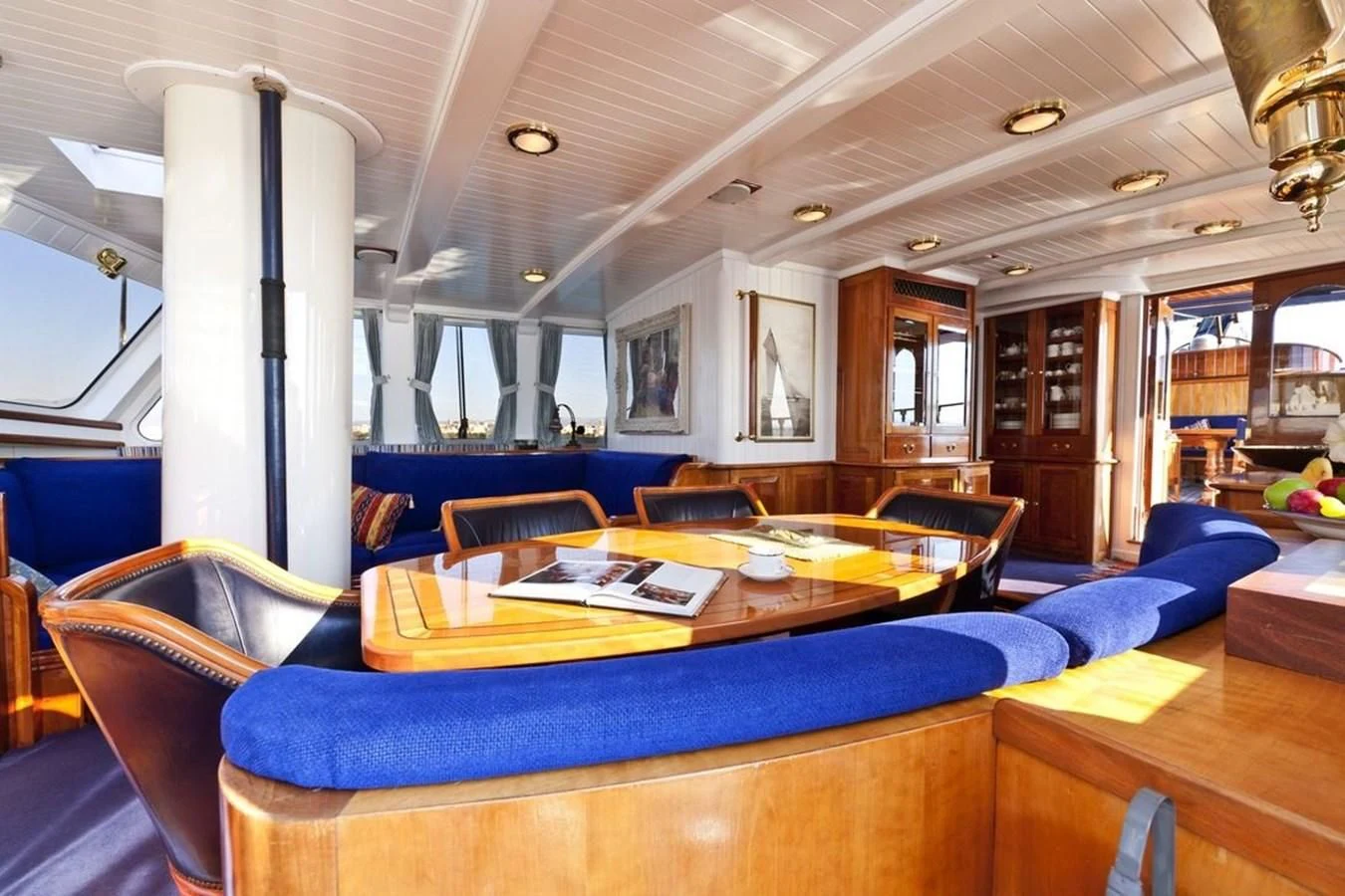a room with a table and chairs aboard TIGERLILY OF CORNWALL Yacht for Sale