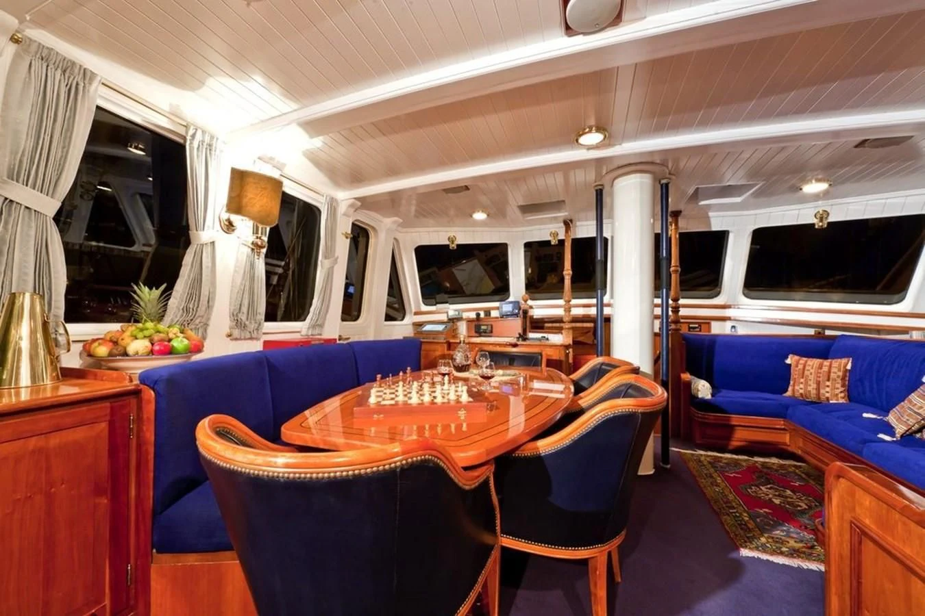 a room with a table and chairs aboard TIGERLILY OF CORNWALL Yacht for Sale