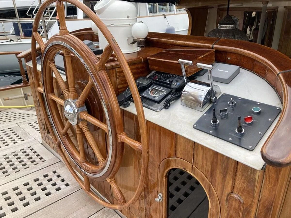 a guitar leaning against a table aboard TIGERLILY OF CORNWALL Yacht for Sale