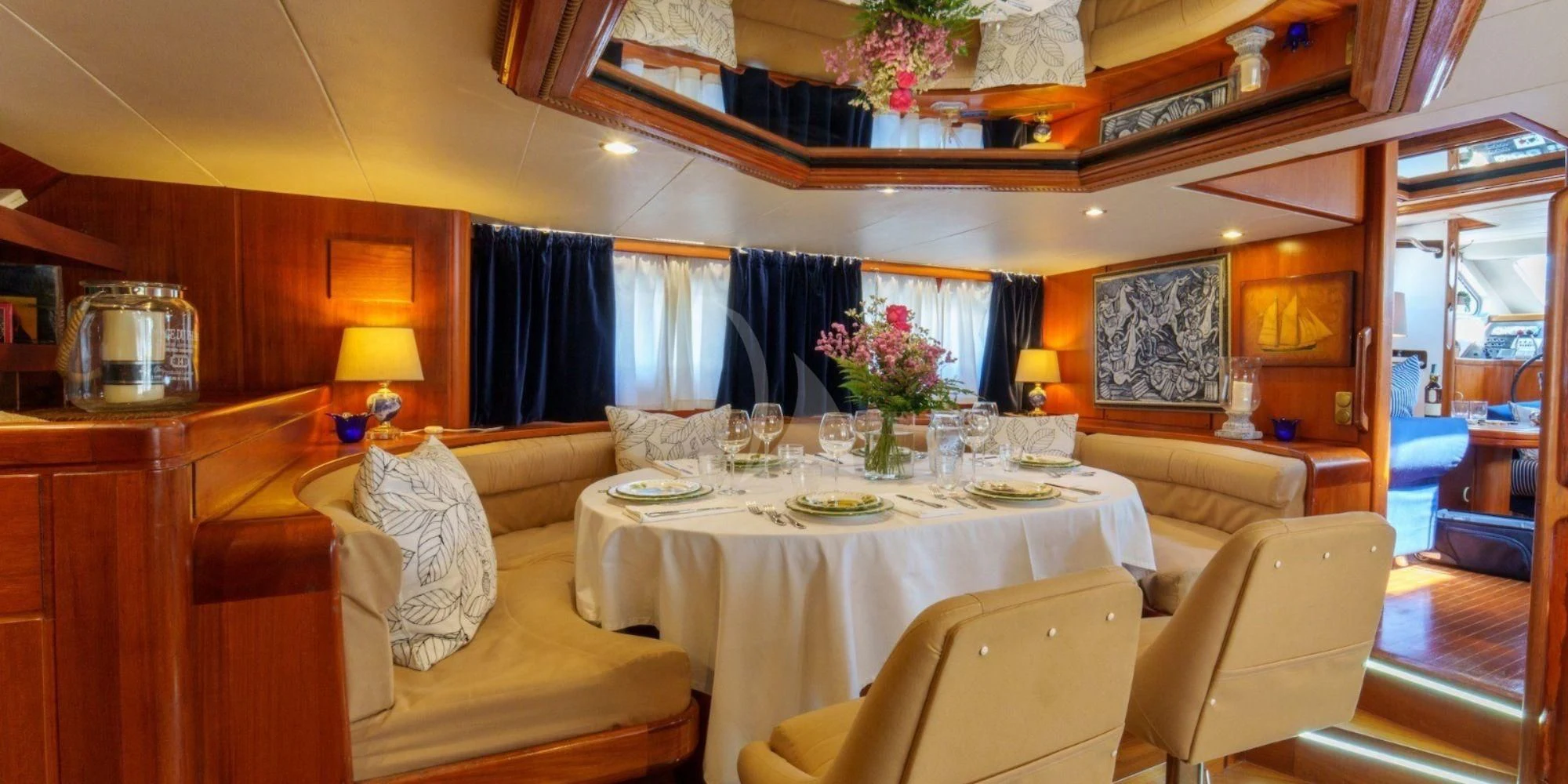 a large dining room with a table aboard WHITE STAR OF RORC Yacht for Sale