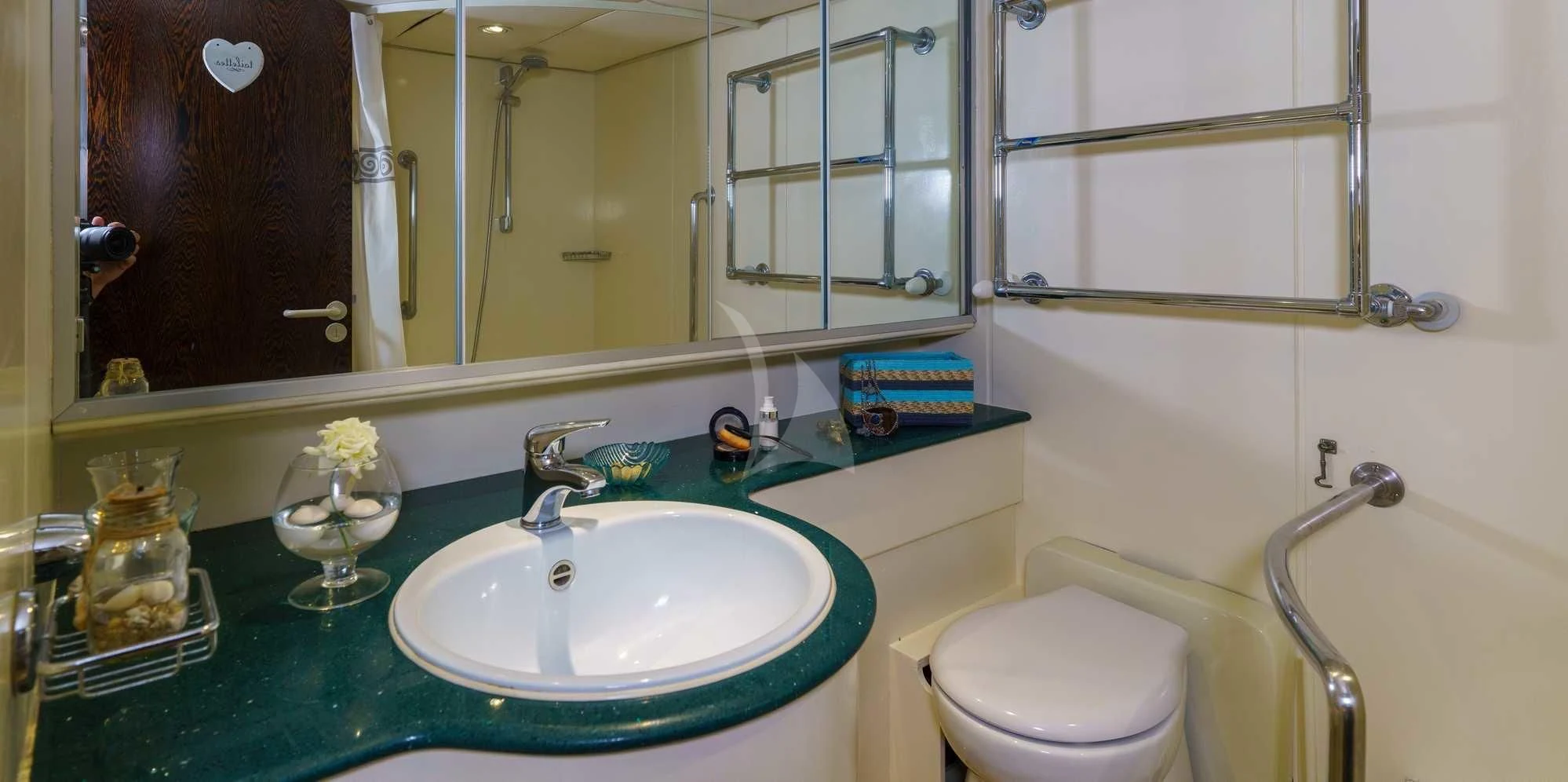 a bathroom with a sink and a mirror aboard WHITE STAR OF RORC Yacht for Sale