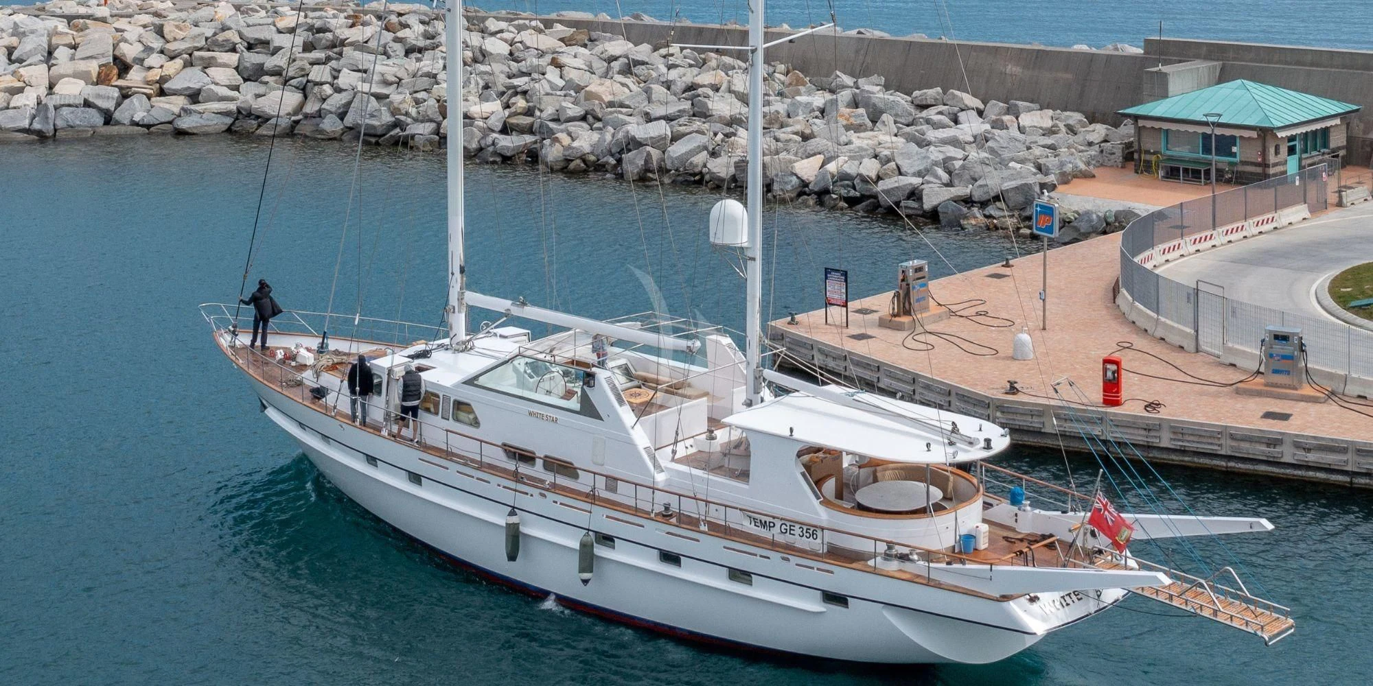 a boat docked at a pier aboard WHITE STAR OF RORC Yacht for Sale