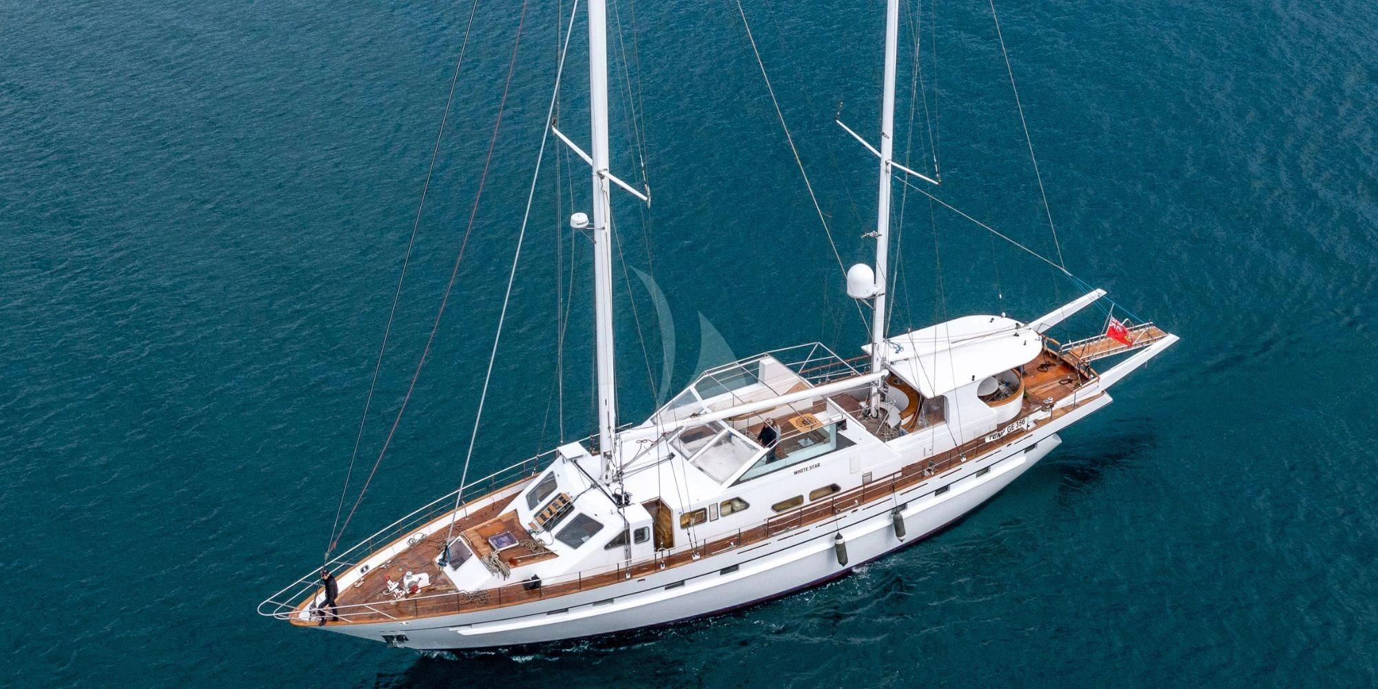 a white boat in the water aboard WHITE STAR OF RORC Yacht for Sale