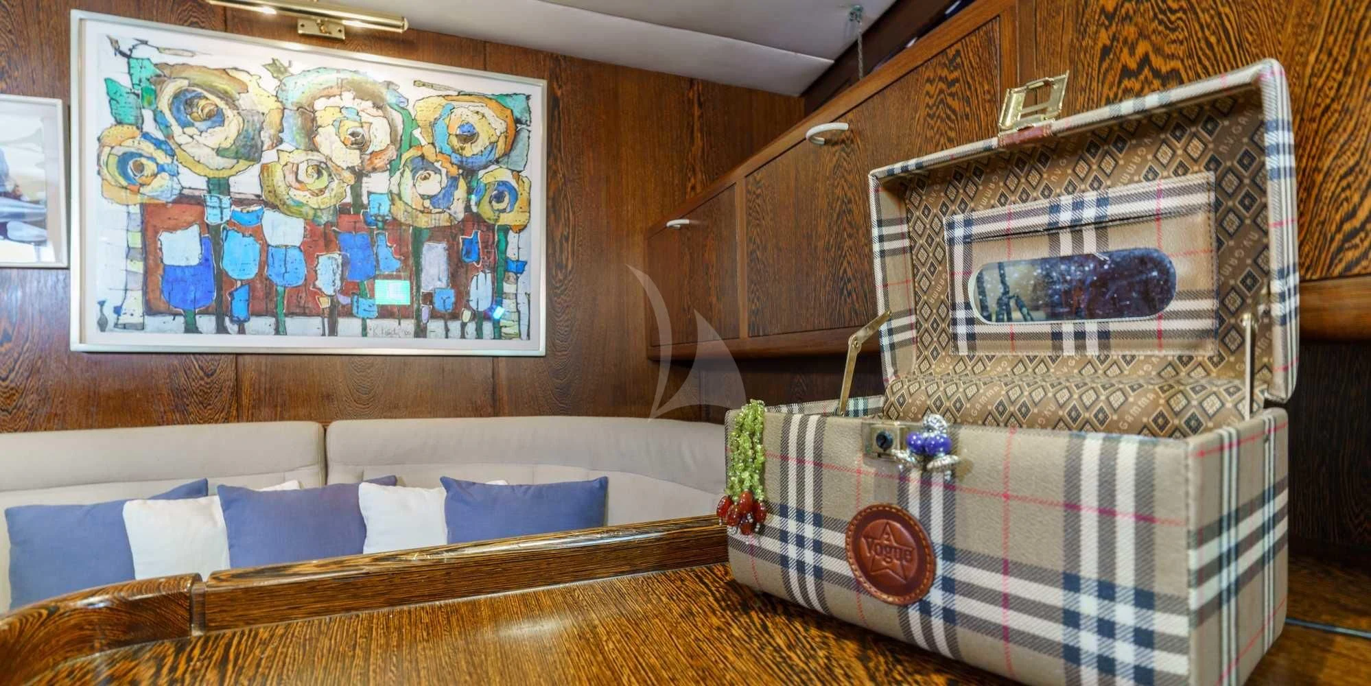 a room with a couch and a table with a painting on it aboard WHITE STAR OF RORC Yacht for Sale