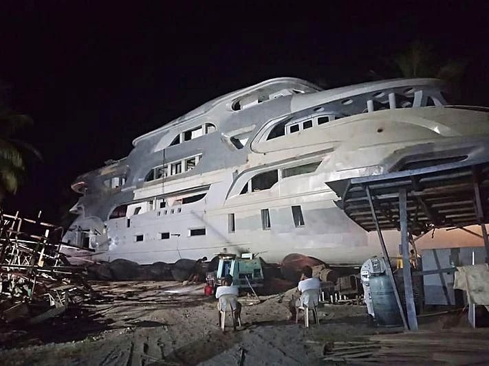 a wrecked white boat aboard MY QUEEN 888 Yacht for Sale