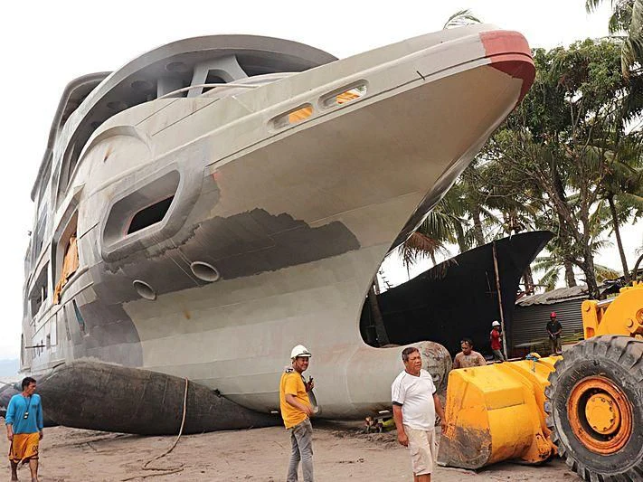 a group of people standing next to a crashed airplane aboard MY QUEEN 888 Yacht for Sale
