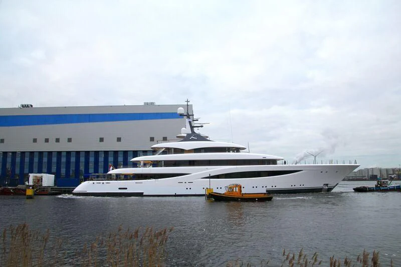 a large white boat in a body of water aboard JUICE Yacht for Sale