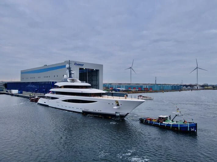 a large white boat sits in the water aboard JUICE Yacht for Sale