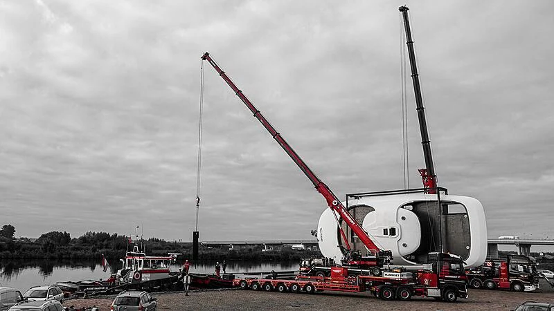 a large crane on a dock aboard JUICE Yacht for Sale