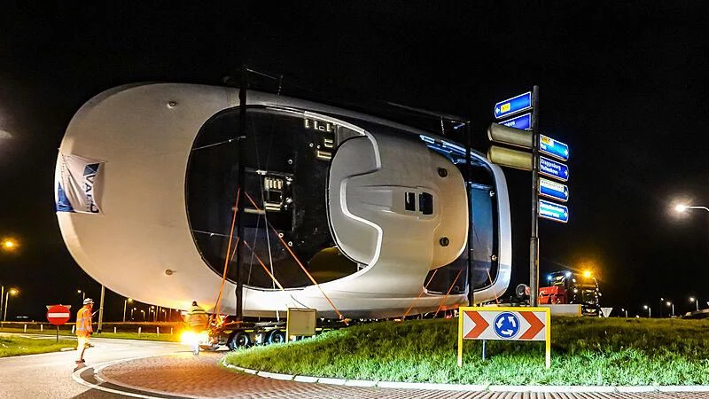 a large satellite dish on a road aboard JUICE Yacht for Sale