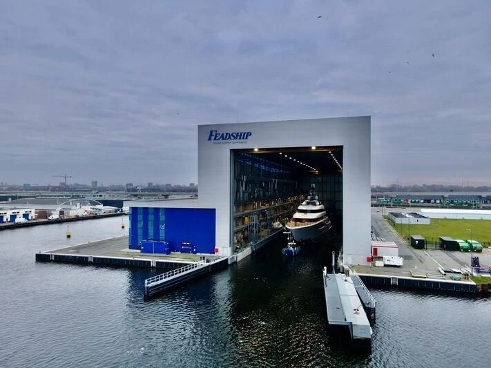 a building with a sign on the roof aboard JUICE Yacht for Sale