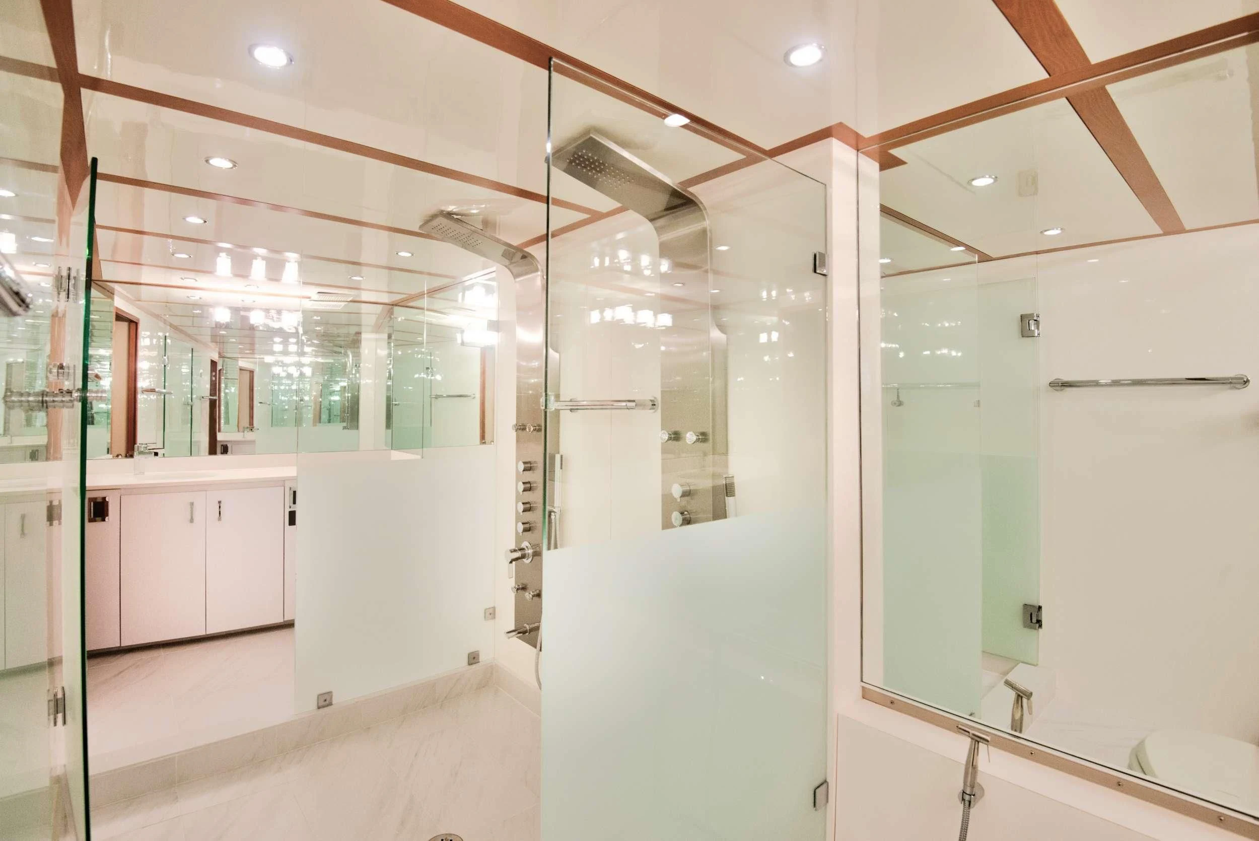 a room with white cabinets aboard DESLIZE Yacht for Sale