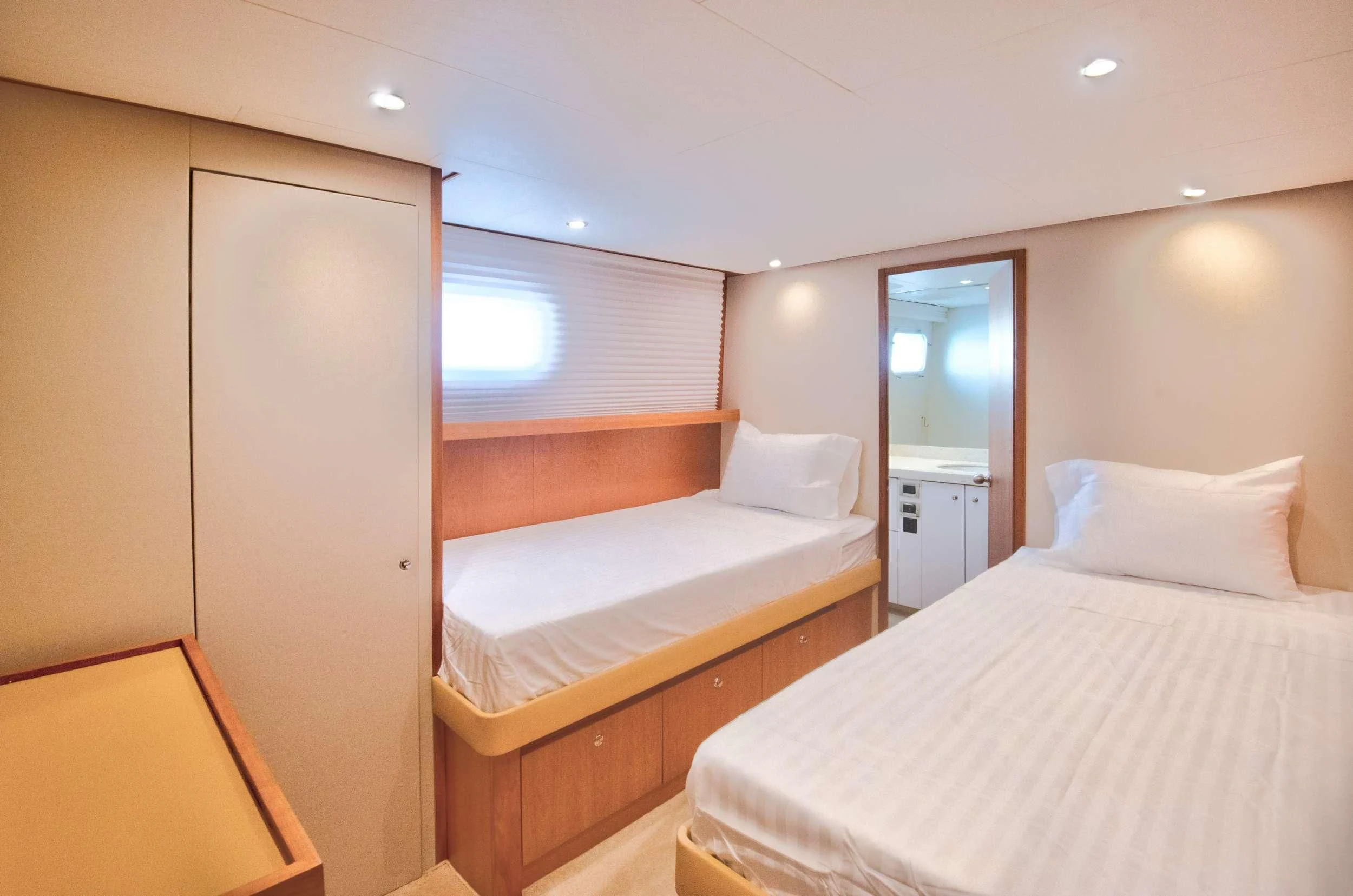 a room with two beds aboard DESLIZE Yacht for Sale
