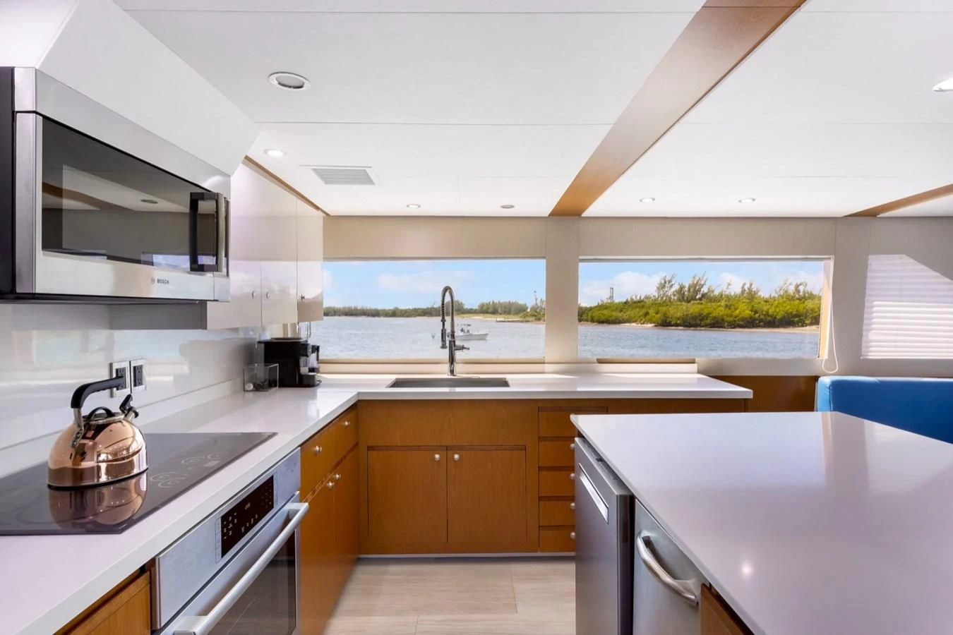 a kitchen with a stove and a sink aboard DESLIZE Yacht for Sale