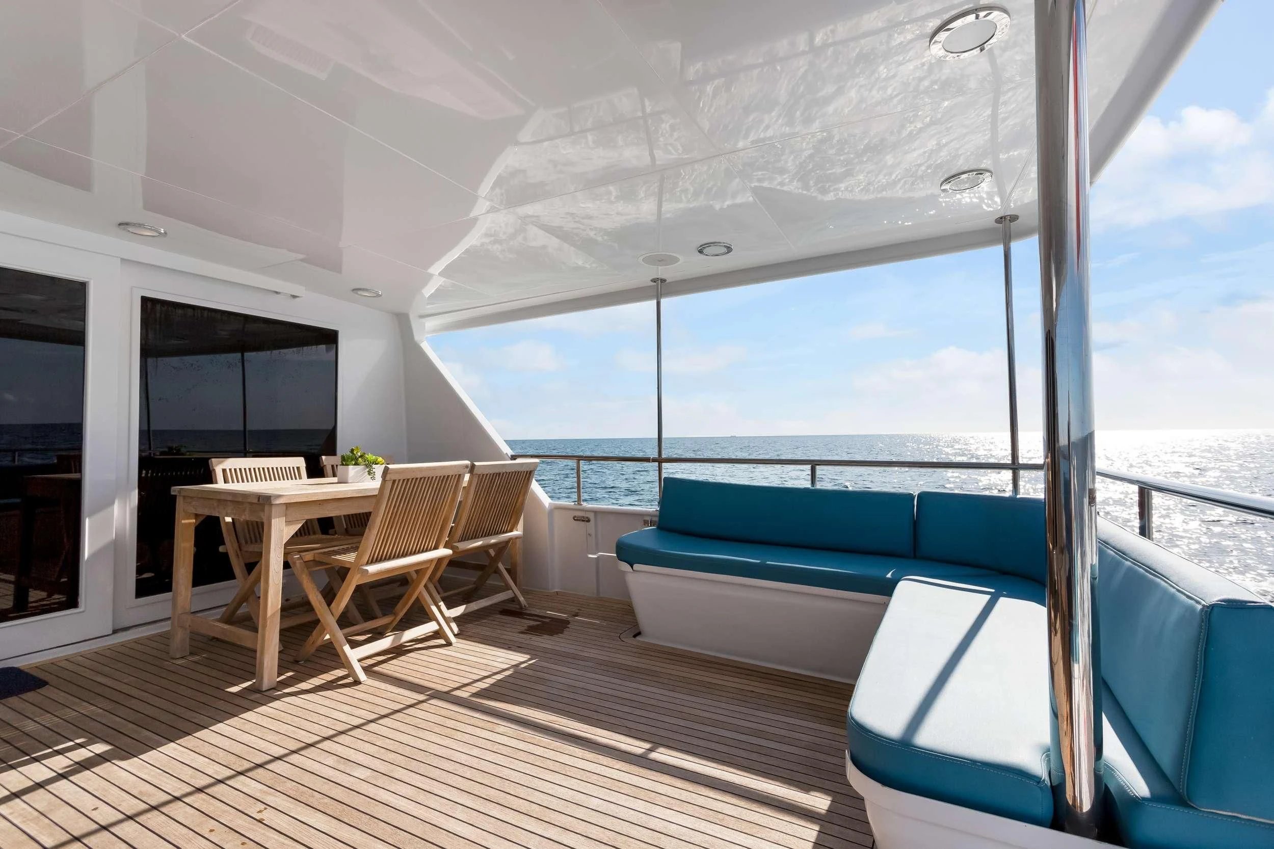 a room with a table and chairs aboard DESLIZE Yacht for Sale
