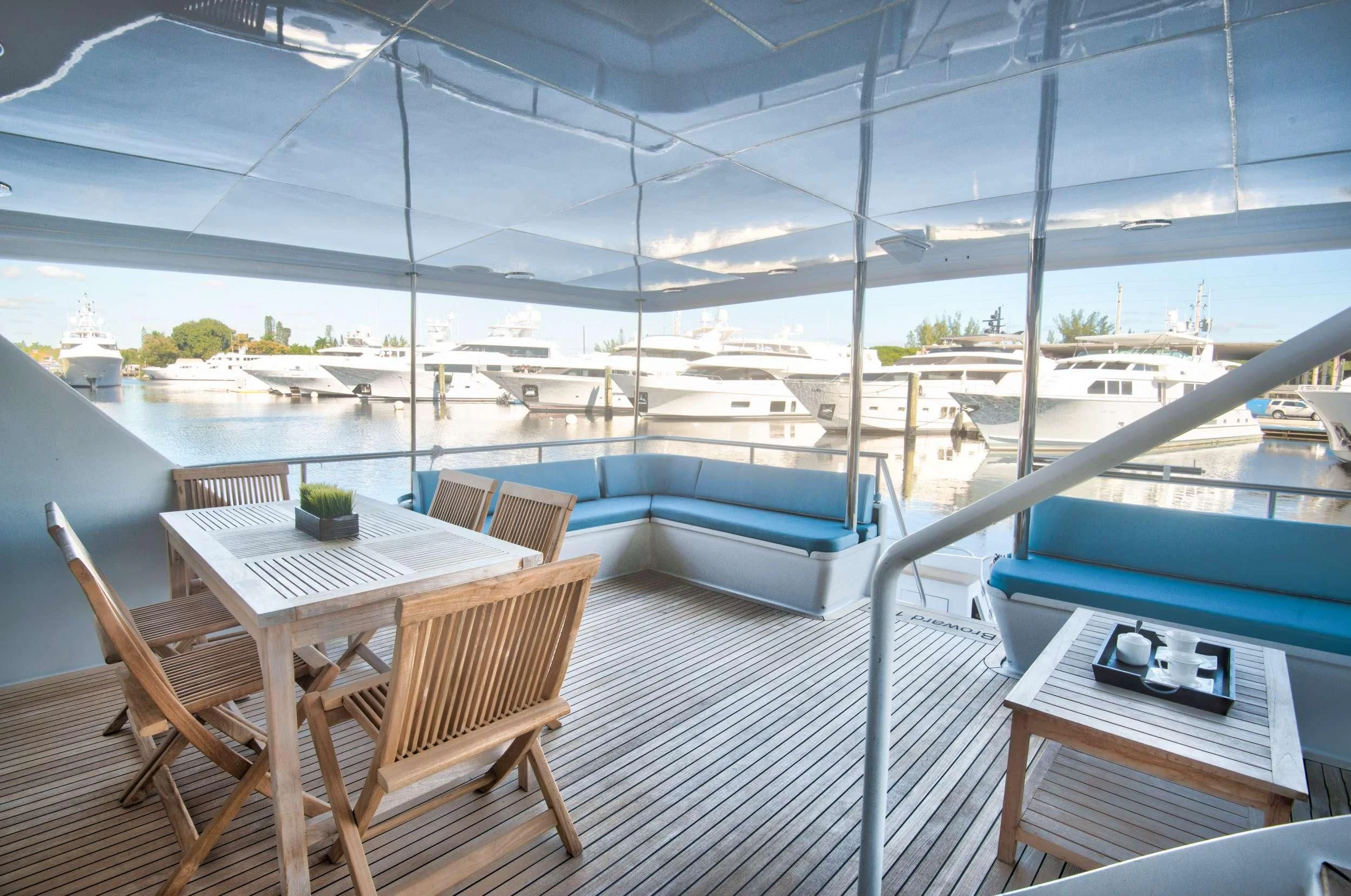 a deck with a view of a city and water aboard DESLIZE Yacht for Sale