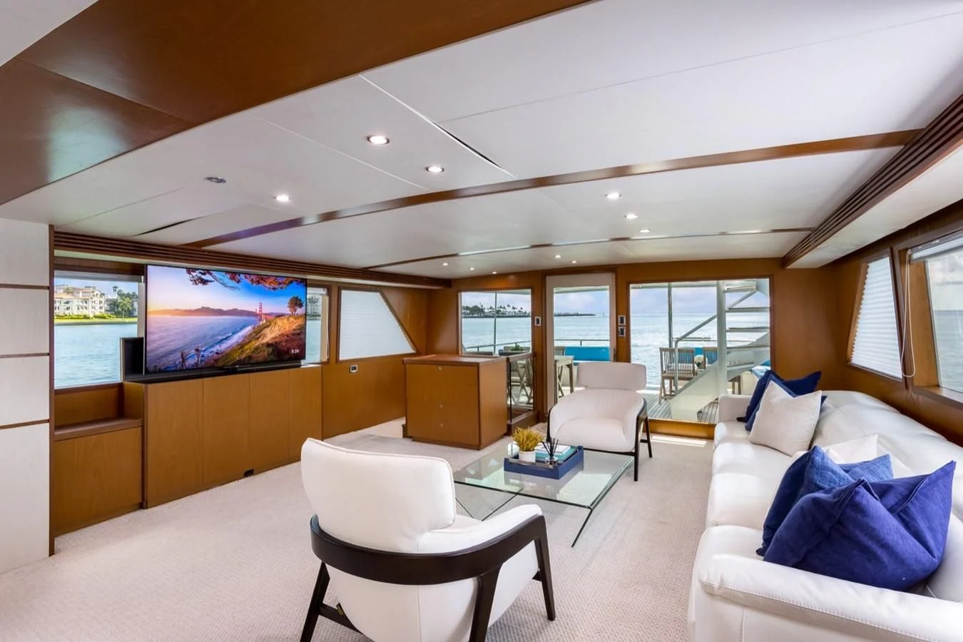 a living room with a large window aboard DESLIZE Yacht for Sale