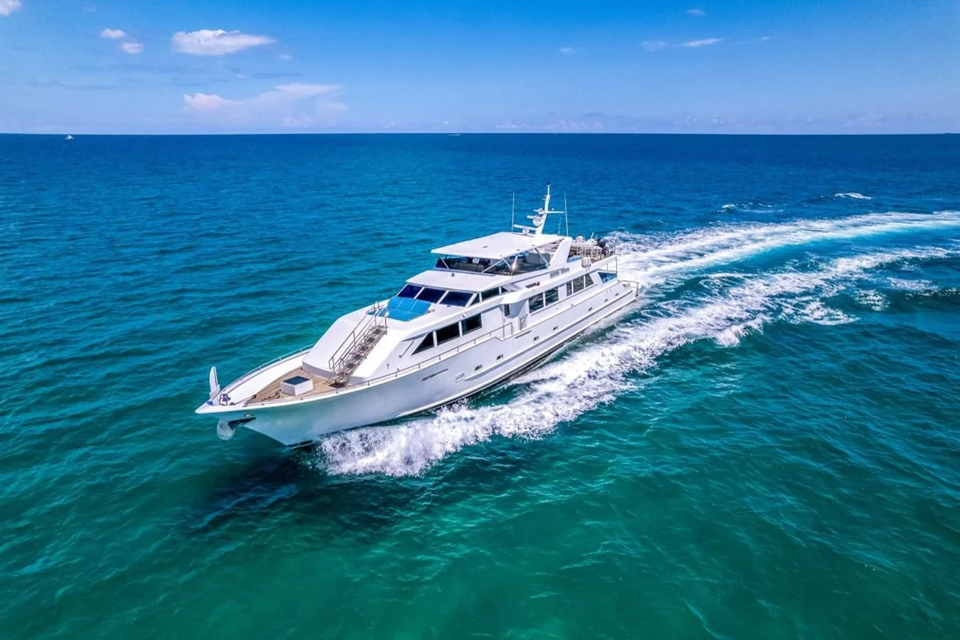 a white boat in the water aboard DESLIZE Yacht for Sale