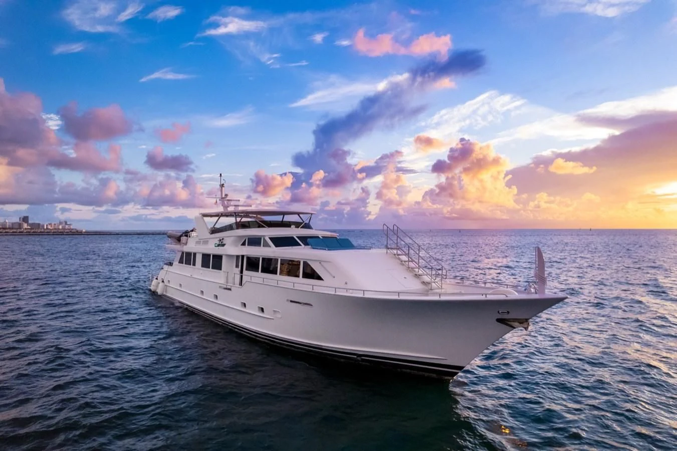 a white yacht in the water aboard DESLIZE Yacht for Sale