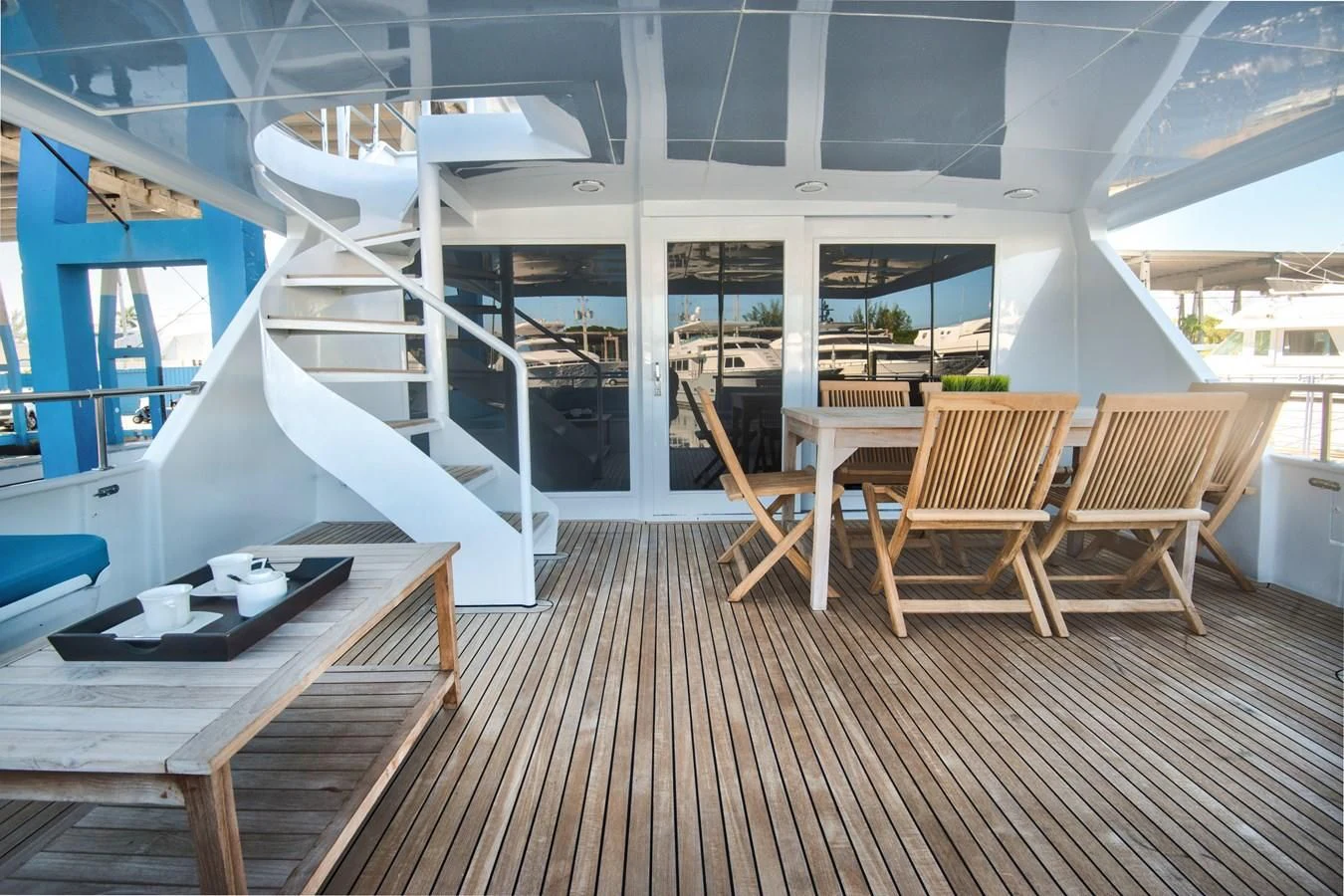 a room with a wood floor and white walls and a staircase aboard DESLIZE Yacht for Sale