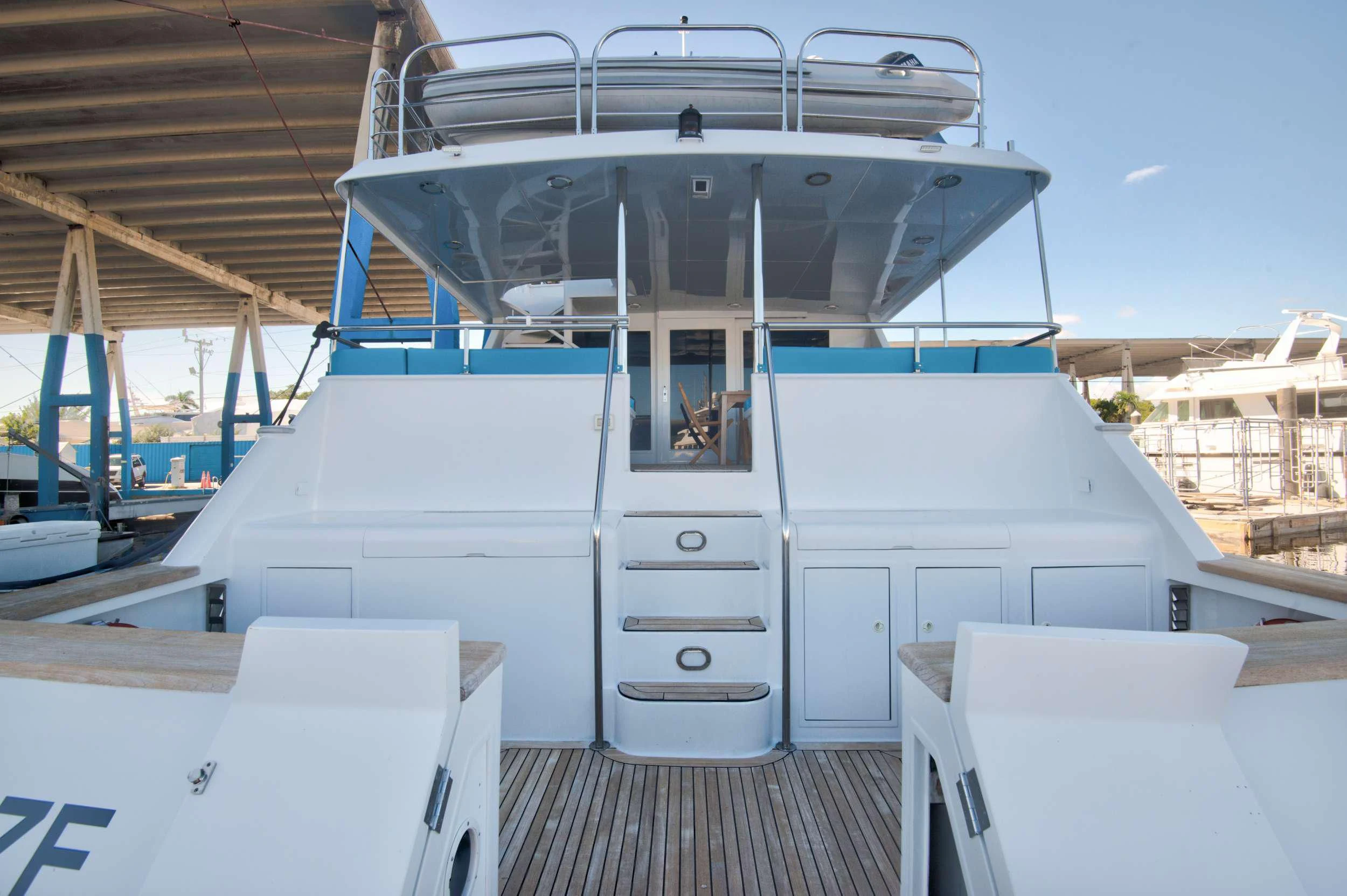 a white boat with a door aboard DESLIZE Yacht for Sale