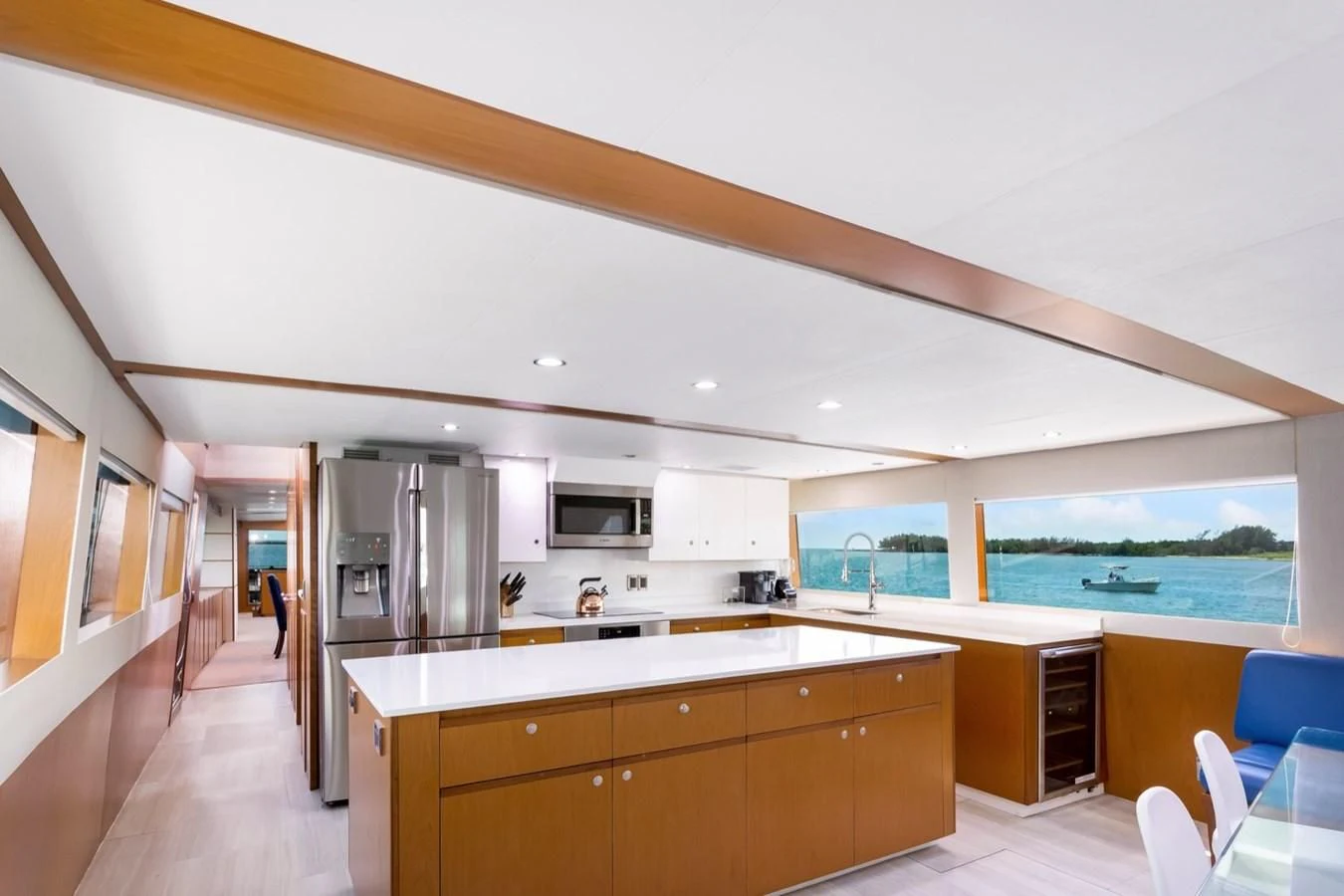 a kitchen with a large window aboard DESLIZE Yacht for Sale