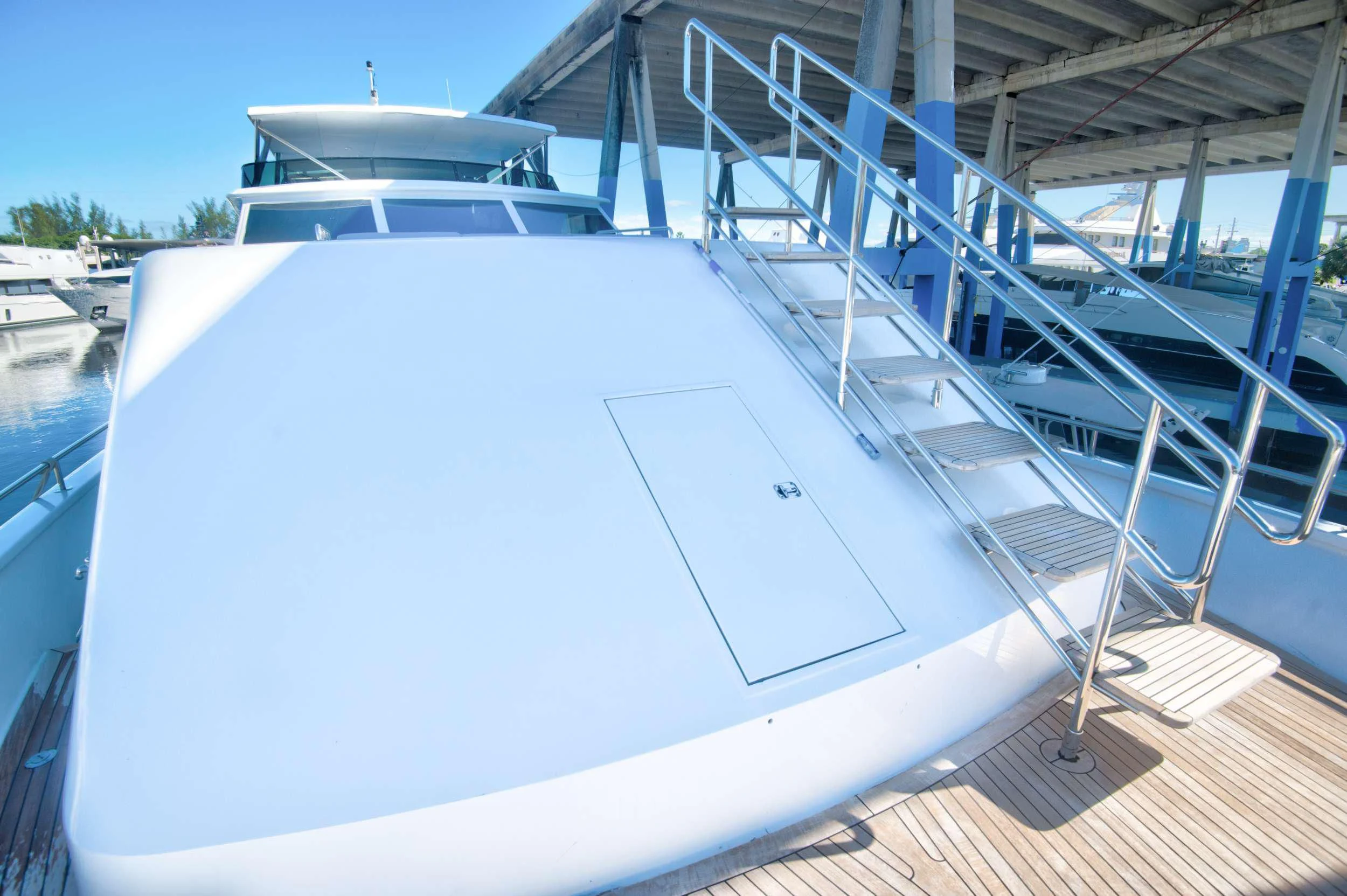 a white boat on a deck aboard DESLIZE Yacht for Sale