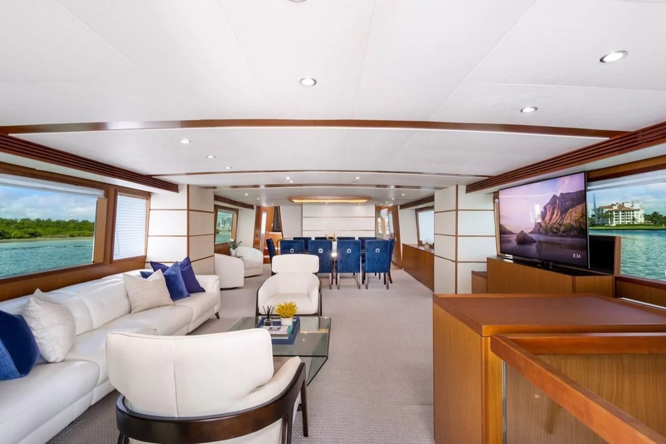 a living room with a large screen aboard DESLIZE Yacht for Sale