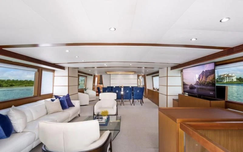a room with a couch and a television aboard DESLIZE Yacht for Sale