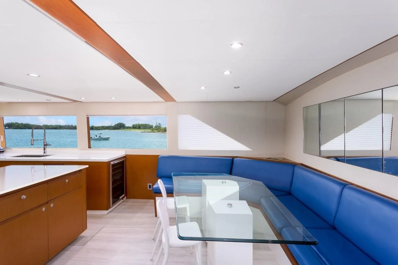 a room with a table and chairs aboard DESLIZE Yacht for Sale
