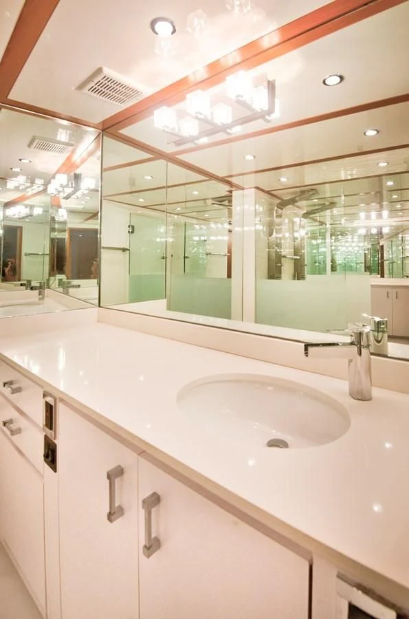 a bathroom with a large mirror aboard DESLIZE Yacht for Sale