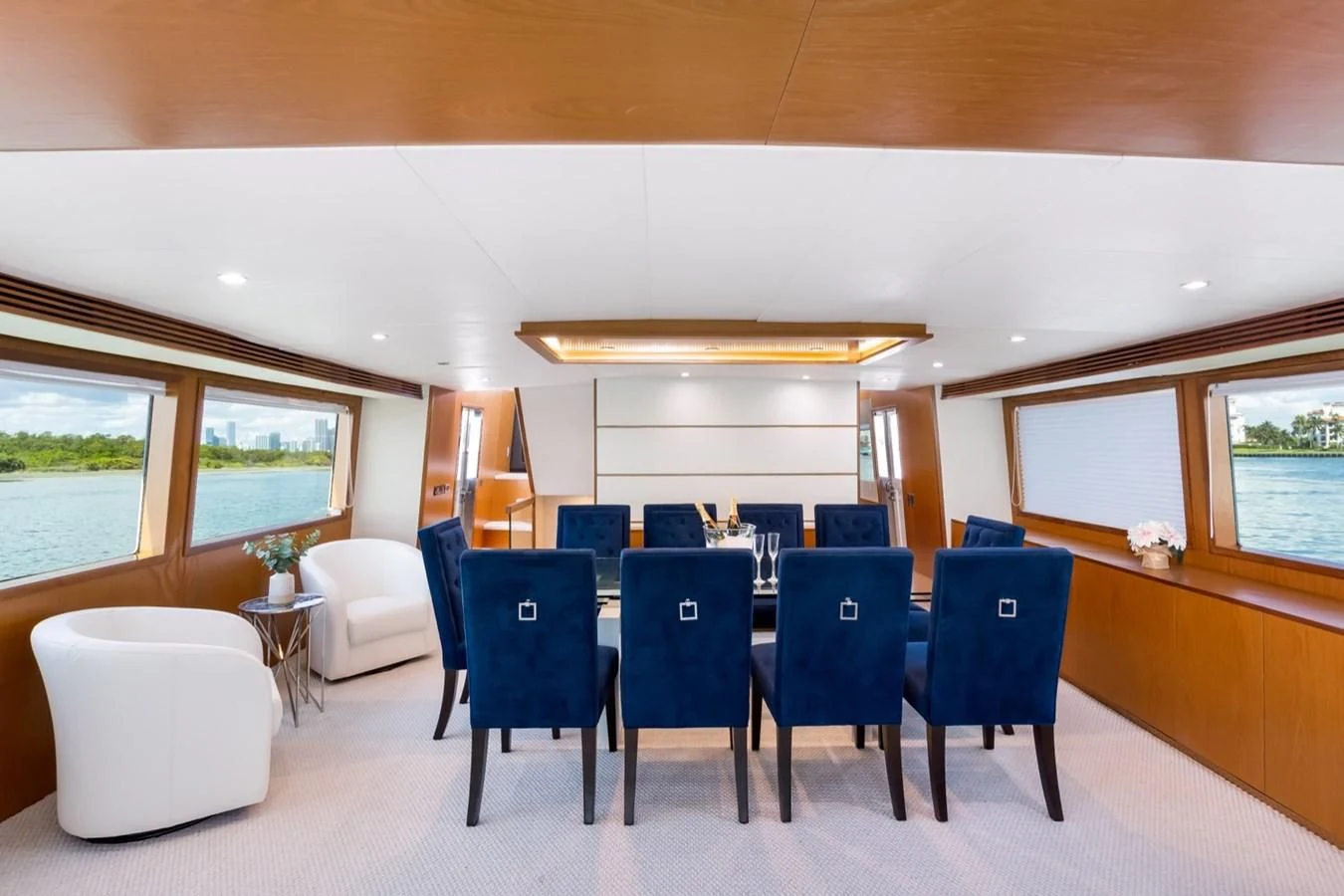 a room with a table chairs and a window aboard DESLIZE Yacht for Sale