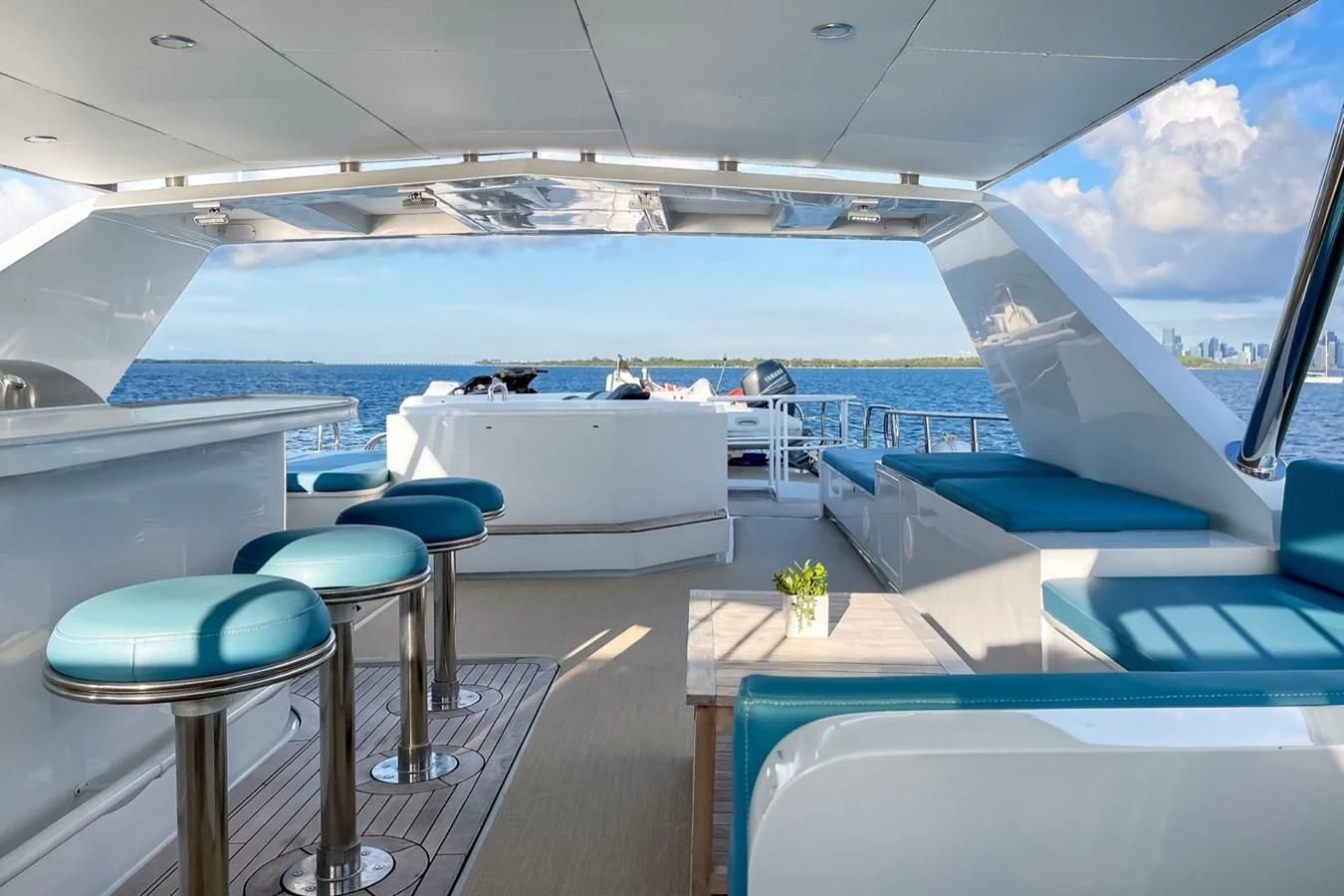 a boat with a table and chairs aboard DESLIZE Yacht for Sale