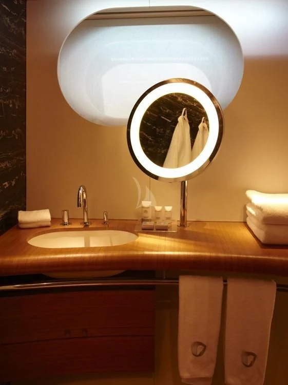 a bathroom with a large mirror aboard PANTHALASSA Yacht for Sale