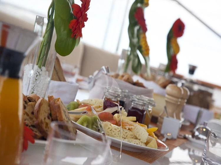 a table full of food aboard PANTHALASSA Yacht for Sale