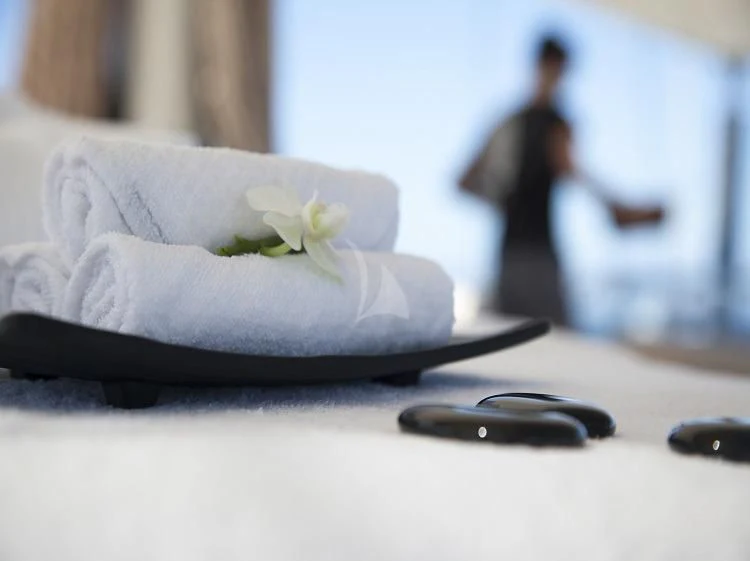 a white flower on a table aboard PANTHALASSA Yacht for Sale